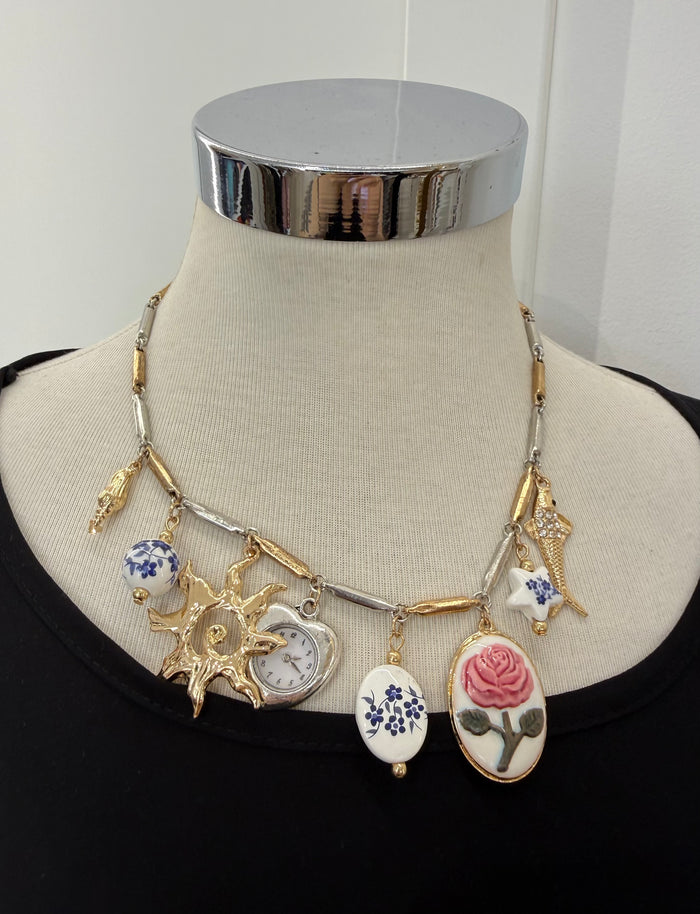 Collana orologio con sole oro