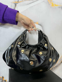 Mezzaluna con borchie