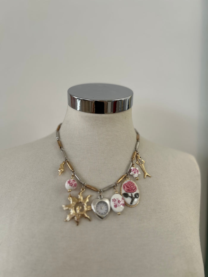 Collana orologio con sole oro
