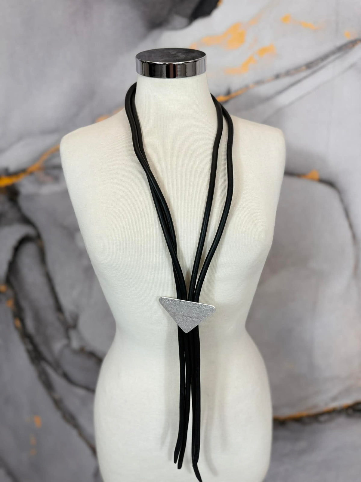 Rubber strand necklace with triangle